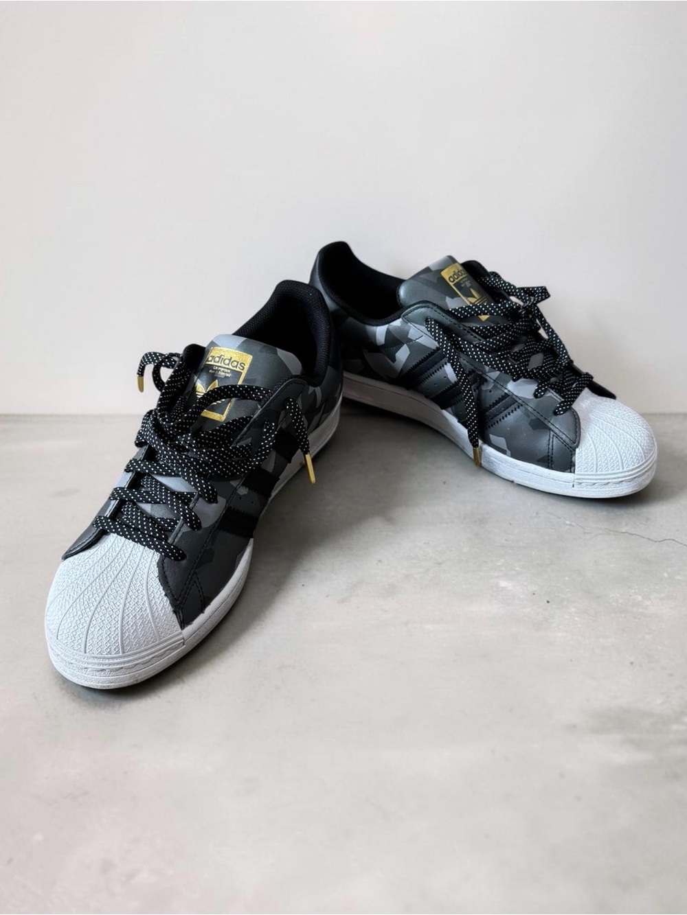 adidas Black & White Patterned Superstar Sneakers with Gold Accents